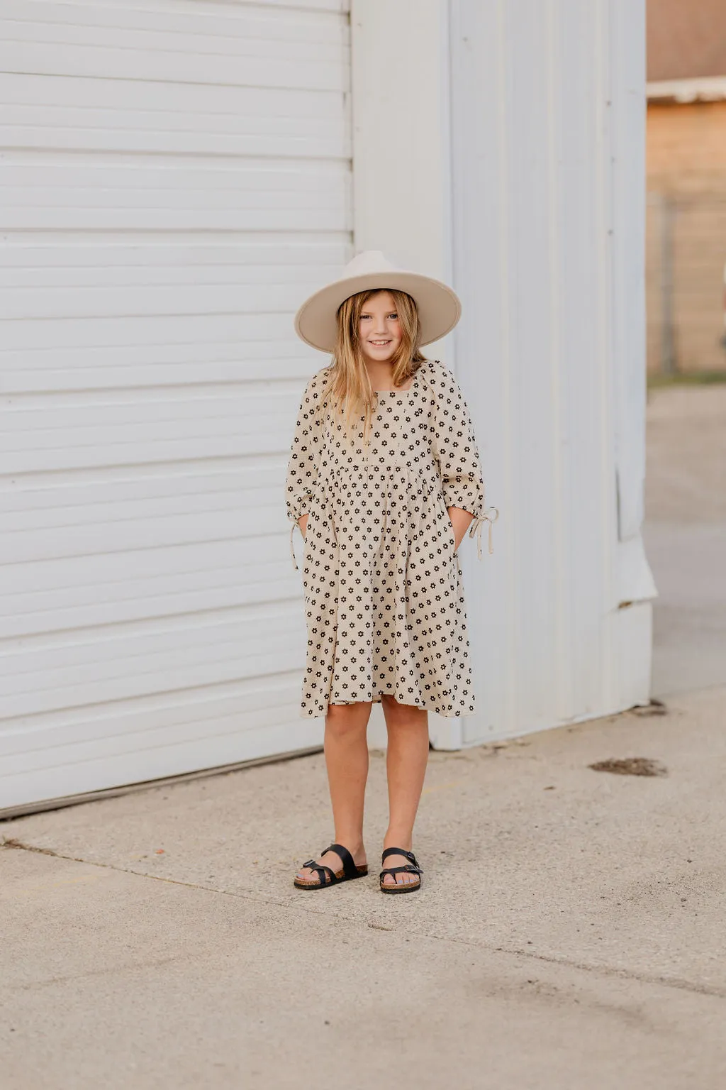 BECCA GIRLS FLORAL CREAM DRESS WITH BLACK FLOWERS